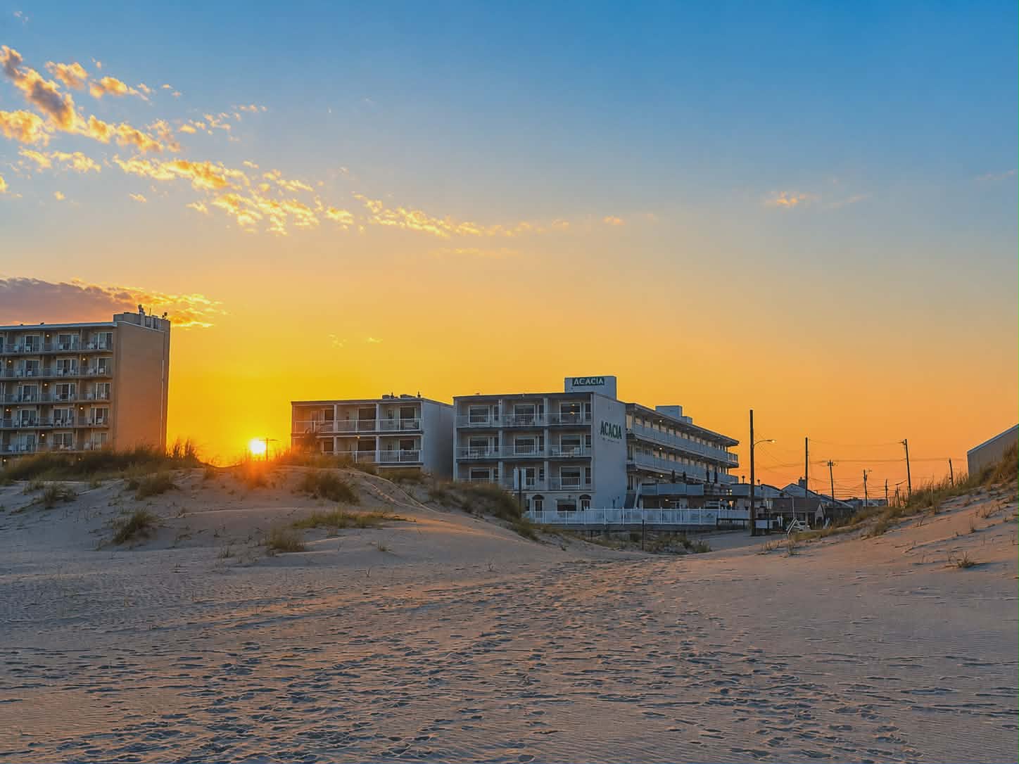 Acacia building from beach at sunset